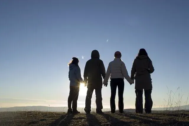 People connecting in a circle, representing finding community support in grief